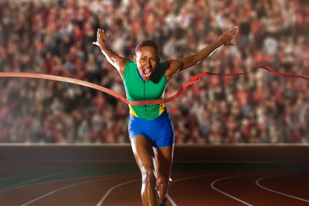 athlete crossing finish line thanks to orthopaedics and sports medicine